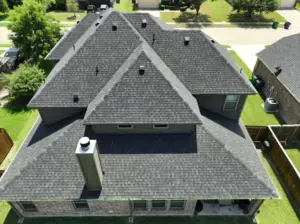 a house with a few trees and a driveway